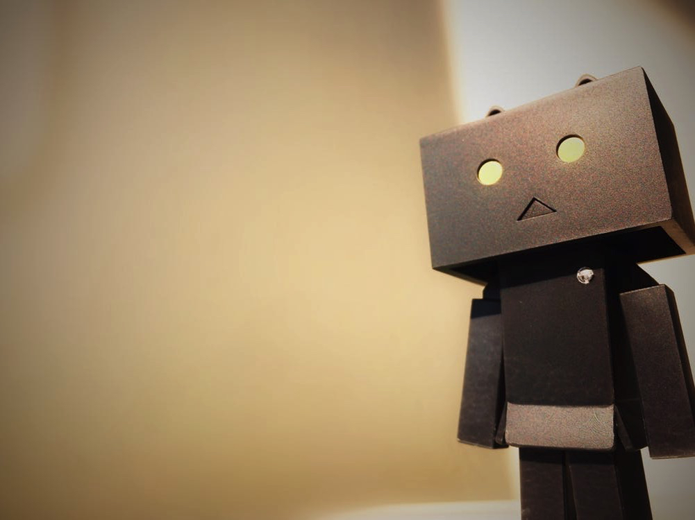 robot with a square head and yellow eyes
