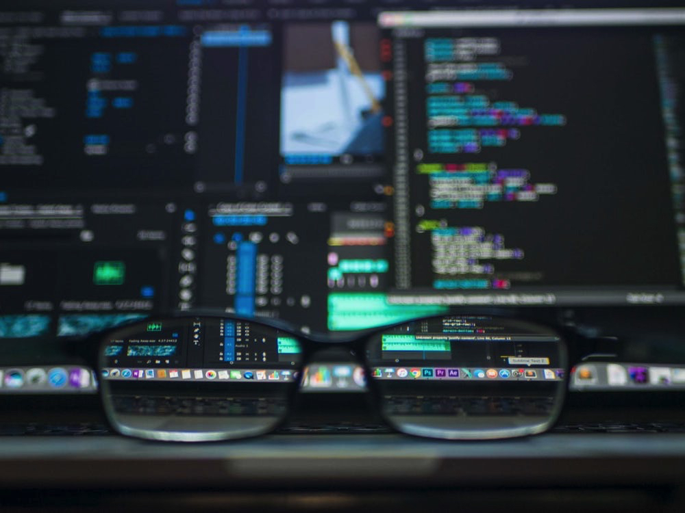 glasses in front of computer screen