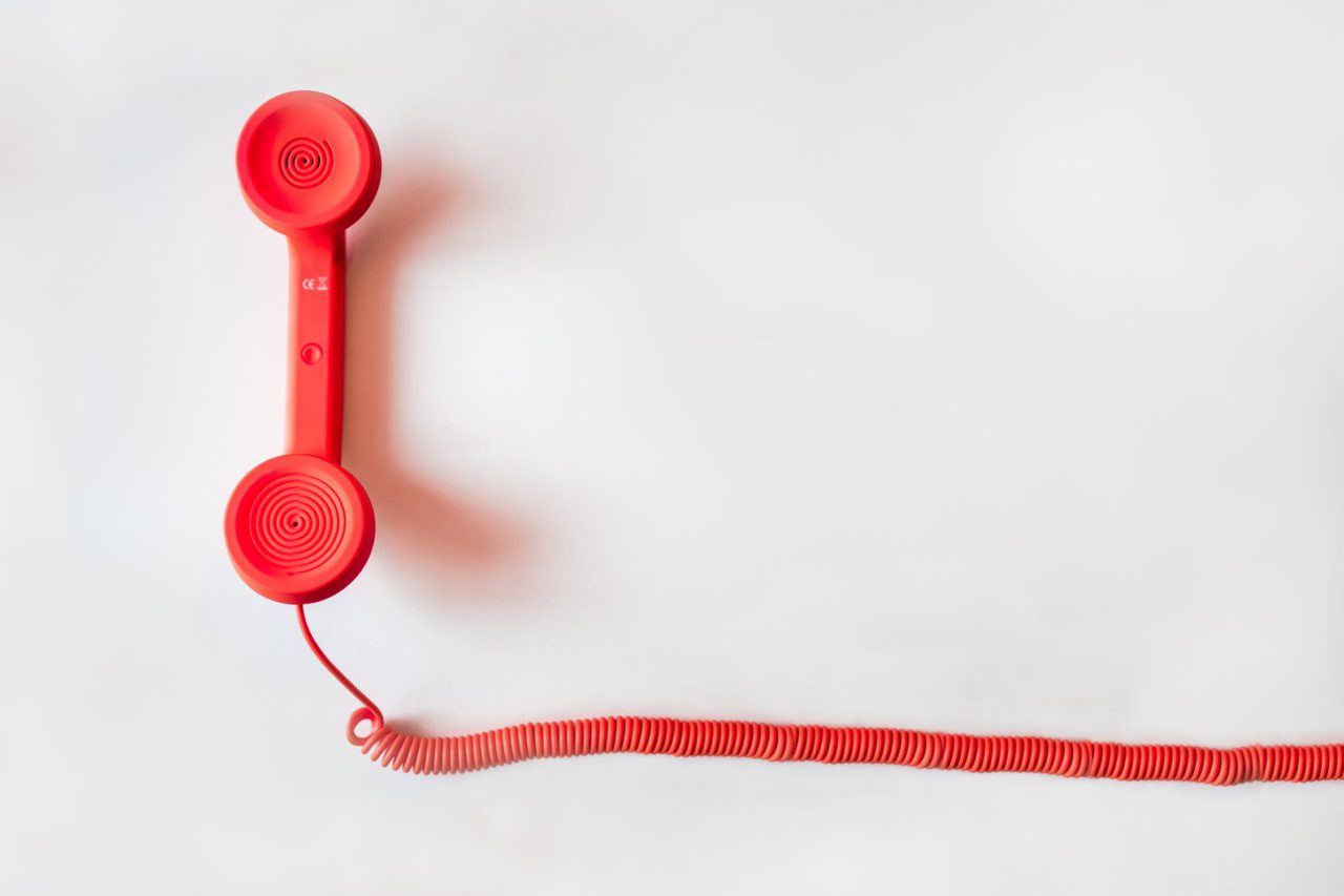 red telephone with a cord